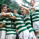 Matt O'Riley and Carl Starfelt celebrate Jota making it 2-0 to Celtic against Rangers.