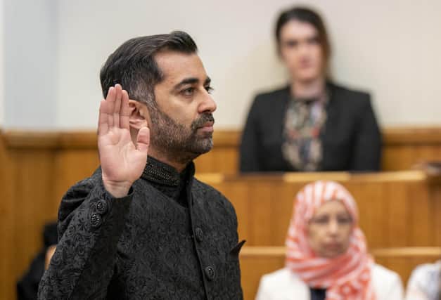 Humza Yousaf takes the oath as he is sworn in as First Minister of Scotland at the Court of Session, Edinburgh. Picture date: Wednesday March 29, 2023.