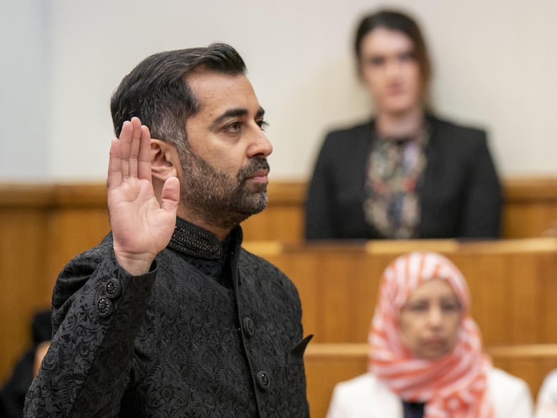 Humza Yousaf takes the oath as he is sworn in as First Minister of Scotland at the Court of Session, Edinburgh. Picture date: Wednesday March 29, 2023.