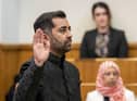 Humza Yousaf takes the oath as he is sworn in as First Minister of Scotland at the Court of Session, Edinburgh. Picture date: Wednesday March 29, 2023.