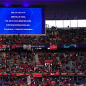 The giant screen informing fans of a delayed kick off ahead of the UEFA Champions League Final at the Stade de France, Paris.