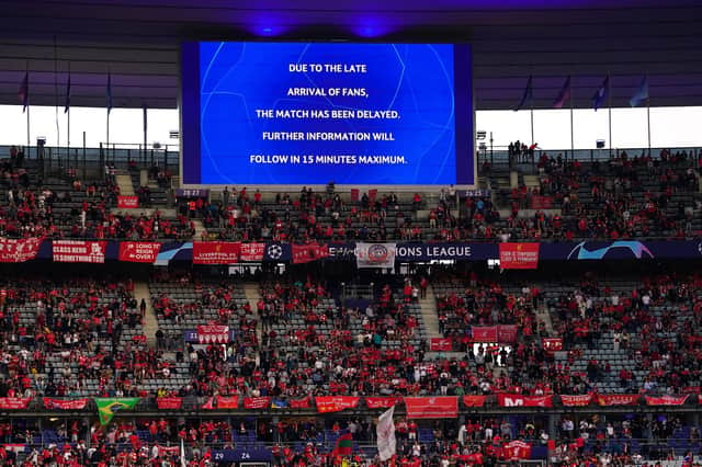 The giant screen informing fans of a delayed kick off ahead of the UEFA Champions League Final at the Stade de France, Paris.