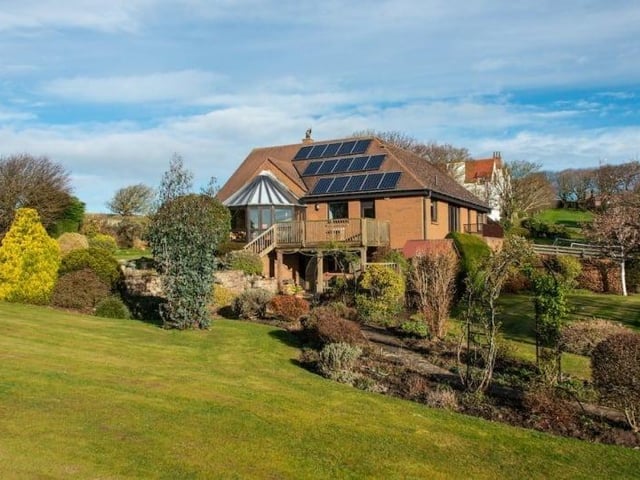 Located in the pretty East Lothian coastal town of Gullane, The Whim is a five bedroom detached family home with a separate two bedroom cottage and stunning views across Gullane and its golf course. The garden extends to about 0.72 acres and contains a summerhouse, a lean-to greenhouse, and an external garden storage cupboard. The current owners are looking for offers over £1.405 million and are prepared to discuss selling the house and cottage separately.