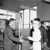 Queen Elizabeth II wears white overalls during a visit to Rothes Colliery, near Kirkcaldy, in June 1958.