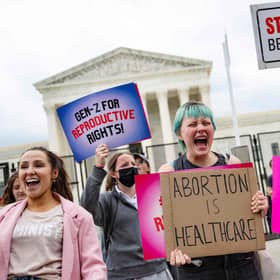 Pro-choice demonstrators chant in front of un-scalable fence that stands around the US Supreme Court in Washington, DC, on May 5, 2022. (Photo by JIM WATSON/AFP via Getty Images)