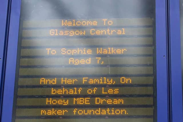 The board at Glasgow central lit up welcoming the seven year-old.