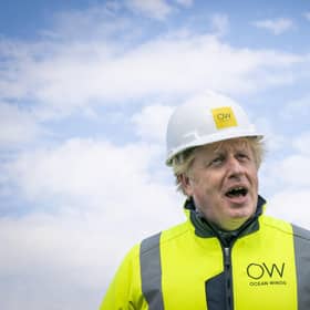 Britain's Prime Minister Boris Johnson speaks, onboard the Esvagt Alba during a visit to the Moray Offshore Windfarm East, off the Aberdeenshire coast, Scotland, Thursday, Aug. 5, 2021. (Jane Barlow/Pool Photo via AP)
