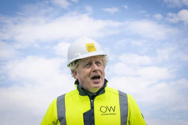 Britain's Prime Minister Boris Johnson speaks, onboard the Esvagt Alba during a visit to the Moray Offshore Windfarm East, off the Aberdeenshire coast, Scotland, Thursday, Aug. 5, 2021. (Jane Barlow/Pool Photo via AP)