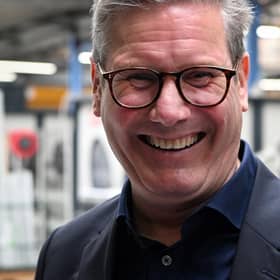 Keir Starmer is all smiles on a visit to Whitburn but Labour faces a tough task in government (Picture: Andy Buchanan/AFP via Getty Images)