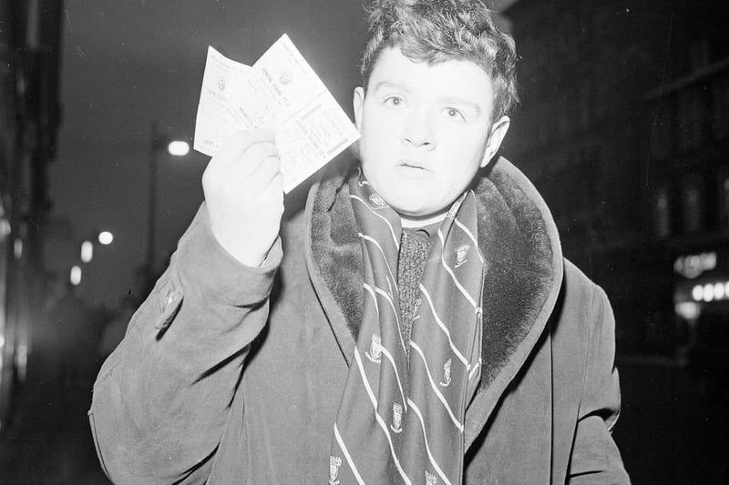 Wearing his official Hearts Supporter scarf, Alex Spence with his 2 tickets for the Hearts v Hibs Edinburgh Derby match to be played at Tynecastle on New Year's day 1965.