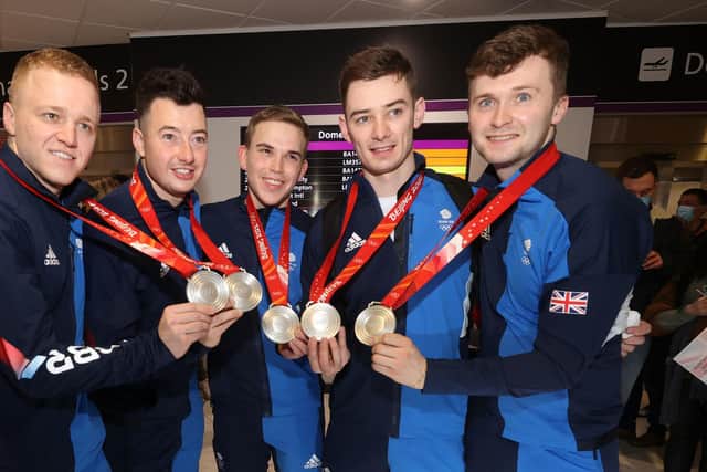 Great Britain curling Silver medalists Bobby Lammie, Hammy McMillan, Ross Whyte, Grant Hardie, Bruce Mouat arrive at Edinburgh Airport.  (Photo credit: Steve Welsh/PA Wire).