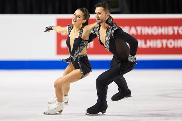 GB skaters Lilah Fear and Lewis Gibson, from Paisely, skate their rhythm dance in the dance competition at Skate Canada International in Vancouver, British Columbia on October 29, 2021. (Photo by Geoff Robins / AFP) (Photo by GEOFF ROBINS/AFP via Getty Images)