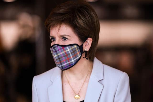 A kilt company has seen an “unbelievable” surge in demand for its tartan face masks after the First Minister was seen wearing one on a public visit on Friday. (Photo by Jeff J Mitchell - WPA Pool/Getty Images)
