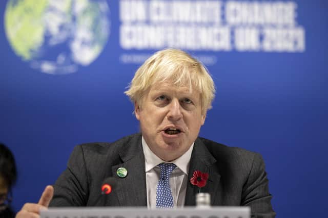 Prime Minister Boris Johnson speaking during the opening ceremony of the COP26 Summit in Glasgow, Monday, Nov. 1, 2021. (Steve Reigate/Pool Photo via AP)