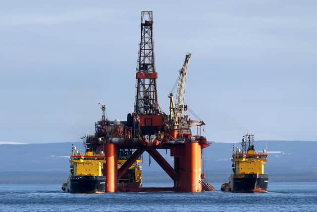 The oil platform Stena Spey is moved with tugboats amongst other rigs. PIC: Andrew Milligan/PA Wire