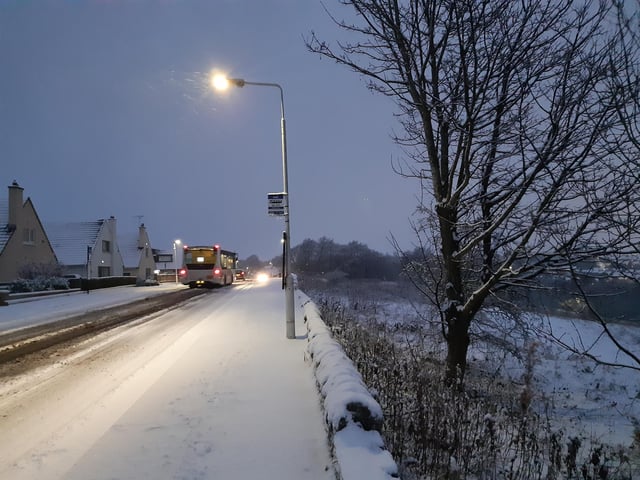 A bus drives down Bennochy Road.