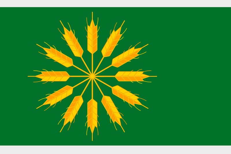 The Isle of Tiree is the most westerly island of the Inner Hebrides. The green colour represents the fertility of the isle while the barley stalks refer to the name of this location 'Land of Barley' (Tìr an Eòrna) - this flag dates to 2018.