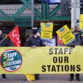 Transport and energy workers from the National Union of Rail, Maritime and Transport Workers (RMT) inside Waverley Station in Edinburgh ahead of a march to the First Minister's office protesting at what they claim is the 'betrayal of Cop26 promises.'