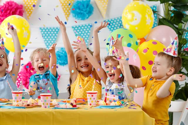 children's birthday. happy kids with cake and balloons Pic: Evgeny Atamanenko