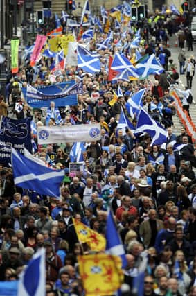 Pro-independence supporters march in Edinburgh ahead of the 2014 referendum.