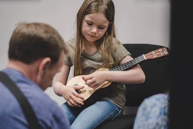Girl playing Ukelele
