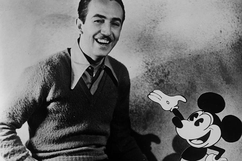 American animator and producer Walt Disney with one of his creations Mickey Mouse.   (Photo by General Photographic Agency/Getty Images)