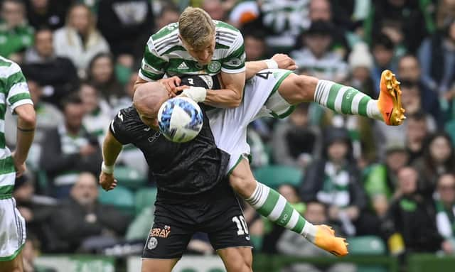 St Mirren's Curtis Main, who netted a double, had the Celtic defence in all sorts of difficulties as demonstrated  in his scrap with Carl Starfelt during the 2-2 draw at Parkhead between the sides. (Photo by Rob Casey / SNS Group)