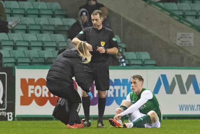 Hibs' Jake Doyle-Hayes goes off injured against Aberdeen.