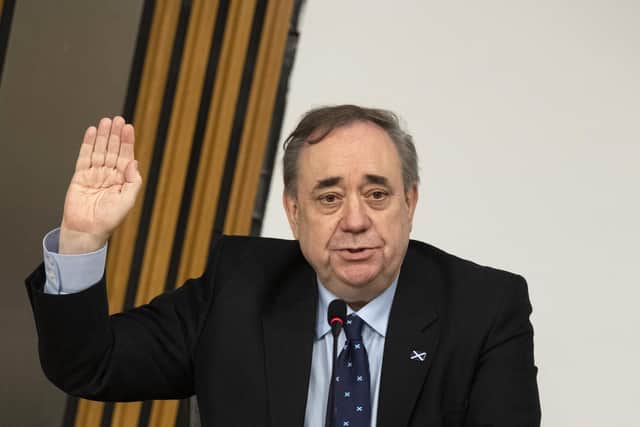 Former First MinisterAlex Salmond is sworn in before giving evidence to the Scottish Parliament committee examining the government's handling of harassment allegations against him.