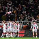 Georgia's players celebrate their equaliser.