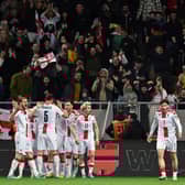 Georgia's players celebrate their equaliser.