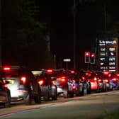 Motorists queue to fill their cars at a Sainsbury's fuel station in Ashford, Kent.