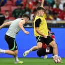 Andy Robertson remains a mainstay of Liverpool's team, but Ben Doak will be hoping to stay involved in the first-team squad.