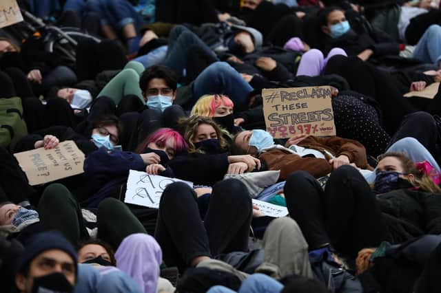 People take part in a minute's 'die-in' at Parliament Square in London on Sunday, the day after clashes between police and crowds who gathered on Clapham Common to remember Sarah Everard (Picture: Aaron Chown/PA)