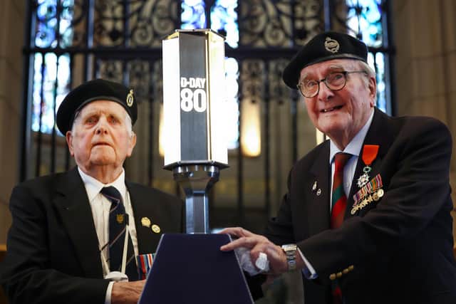 D-Day veterans Cyril ‘Lou’ Bird (right) and John Mitchell (left) during a recent D-Day torch ceremony at Edinburgh Castle. Mr Bird has spoken of the PTSD which has haunted him since landing in Normandy on June 6, 1944. (Photo by Jeff J Mitchell/Getty Images)