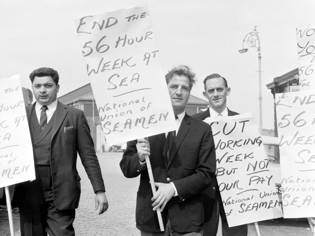 Strikers on picket duty outside Leith Docks, Edinburgh, during the seamen's strike in May 1966.
