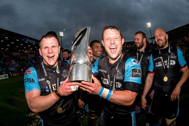 Chris Fusaro, left, and Peter Horne celebrate with the trophy after Glasgow Warriors' victory over Munster in the 2015 Guinness Pro12 final in Belfast. Picture: Gary Hutchison/SNS