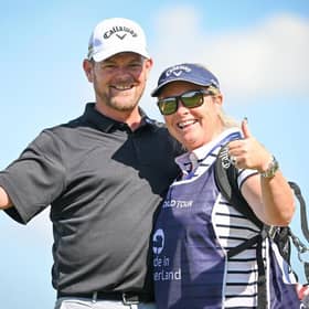 David Drysdale celebrates his hole in one with his caddie and wife Vicky during day two of the Made in HimmerLand at Himmerland Golf & Spa Resort. Picture: Stuart Franklin/Getty Images.