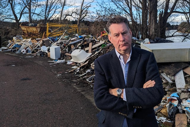 A massive dump site has built up near the Friarton Bridge in Perth, sparking fears over the potential harm to nature and fragile ecosystems. Scottish Conservative MSP Murdo Fraser, who is bringing forward a private member’s bill on fly-tipping to the Scottish Parliament, described the site as “horrendous” when he visited to see it for himself. 
“The amount of rubbish dumped at this site is just horrific,” he said.
“It varies from various disused vehicles, bits of wood, old paint containers, to a mattress and a fridge. 
“It is totally unacceptable for this to happen and I was very concerned that, due to the location of the fly-tipping being on the banks of the River Tay, there could well be a significant environmental risk.”
He believes better collection of data, improved coordination between investigators and tougher penalties for offenders can together cut fly-tipping.