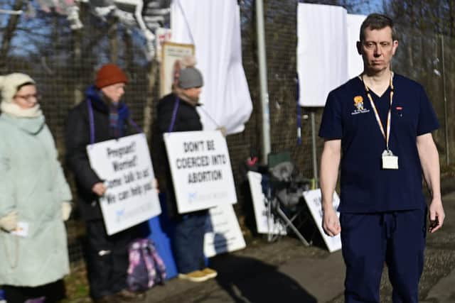 Dr Greg Irwin, in front of the vigil.