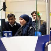 Prime Minister Rishi Sunak looks at the passport control unit next to Border Force officer Samira Bazzar at Gatwick Airport. Picture: Carlos Jasso - WPA Pool/Getty Images
