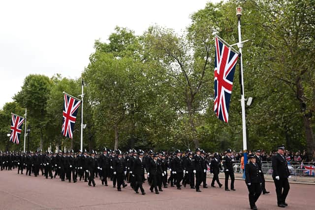 Police officers prepare on The Mall in London on September 19, 2022, ahead of the State Funeral Service of Britain's Queen Elizabeth II.
