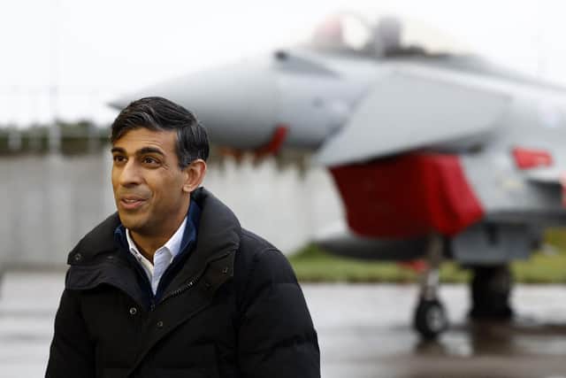 Prime Minister Rishi Sunak stands in front of a Typhoon combat aircraft as he speaks during a media interview during his visit to visit Royal Air Force (RAF) base Lossiemouth in Moray. Picture: Jeff J Mitchell/AFP via Getty Images
