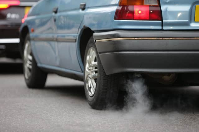 Children can no longer be legally exposed to second-hand cigarette smoke in cars, but they will be breathing in fumes from the exhaust (Picture: Daniel Leal-Olivas/AFP via Getty Images)