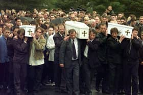 The three coffins of brothers Richard, Mark and Jason Quinn being carried by family and mourners to Rasharkin Church for burial after leaving funeral mass at the Church of  Our Lady and St Patricks, Ballymoney. Picture: Press Association