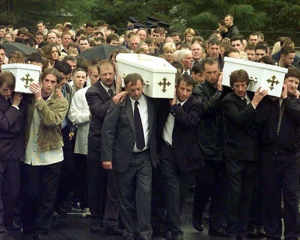 The three coffins of brothers Richard, Mark and Jason Quinn being carried by family and mourners to Rasharkin Church for burial after leaving funeral mass at the Church of  Our Lady and St Patricks, Ballymoney. Picture: Press Association