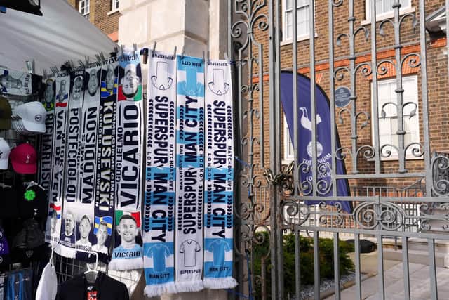 Scarves for sale on a merchandise stall ahead of the Premier League match at the Tottenham Hotspur Stadium, London. Picture date: Tuesday May 14, 2024.