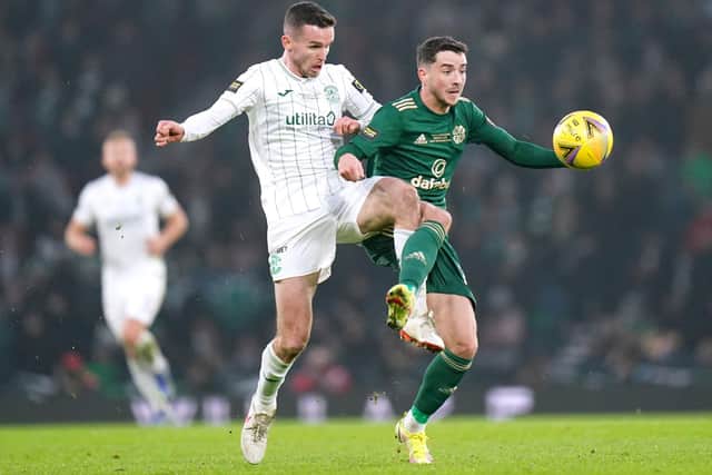 Celtic's Michael Johnston (right) and Hibernian's Paul McGinn battle for the ball during the Premier Sports Cup Final at Hampden (Jane Barlow/PA Wire).