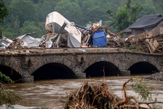 Driftwood and other debris piled up against a bridge over the River Ahr in western Germany in July last year (Picture: Torsten Silz/AFP via Getty Images)