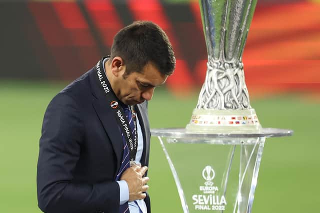 Rangers manager Giovanni van Bronckhorst walks past the Europa League trophy after collecting his runners-up medal. (Photo by Alex Grimm/Getty Images)